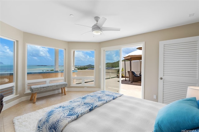 44-97 Kalenakai Pl Unit A, Kaneohe, HI 96744 - bedroom with access to exterior, tile patterned floors, a water view, baseboards, and ceiling fan