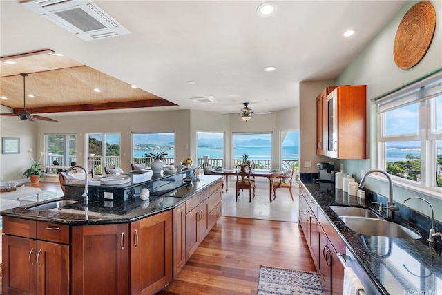 44-97 Kalenakai Pl Unit A, Kaneohe, HI 96744 - kitchen with ceiling fan, a sink, recessed lighting, brown cabinets, and wood finished floors