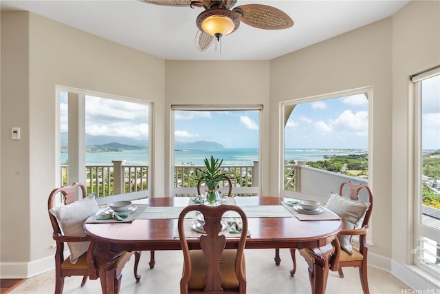 44-97 Kalenakai Pl Unit A, Kaneohe, HI 96744 - dining area featuring a water view, ceiling fan, and baseboards