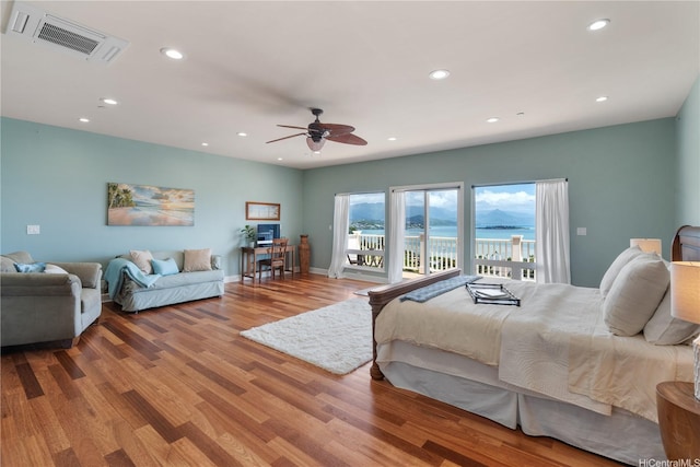 44-97 Kalenakai Pl Unit A, Kaneohe, HI 96744 - bedroom featuring access to outside, recessed lighting, wood finished floors, a ceiling fan, and baseboards