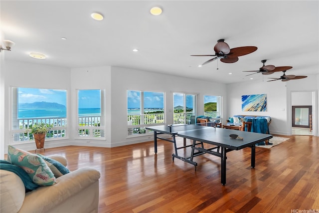 44-97 Kalenakai Pl Unit A, Kaneohe, HI 96744 - playroom with baseboards, wood finished floors, recessed lighting, ceiling fan, and a water view