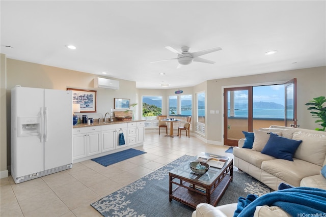 44-97 Kalenakai Pl Unit A, Kaneohe, HI 96744 - living area with an AC wall unit, ceiling fan, light tile patterned floors, recessed lighting, and baseboards