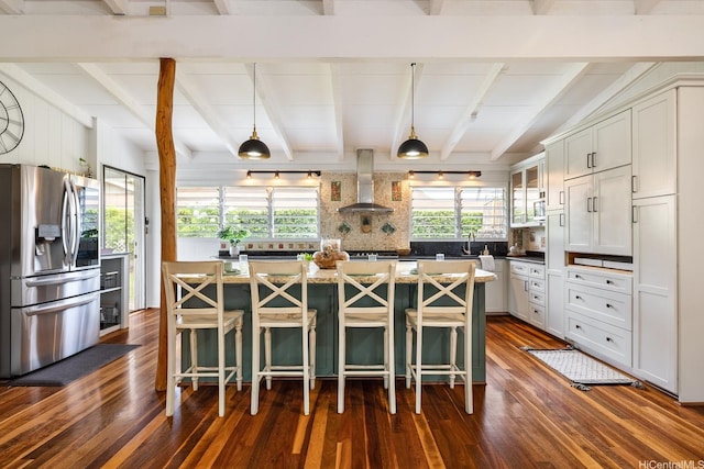 880 Akiu Pl, Kailua, HI 96734 - kitchen featuring stainless steel refrigerator with ice dispenser, wall chimney exhaust hood, dark wood-type flooring, a kitchen island, and a breakfast bar area