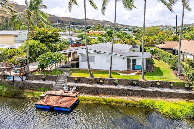 880 Akiu Pl, Kailua, HI 96734 - back of house with stairway, a yard, and a deck with water view