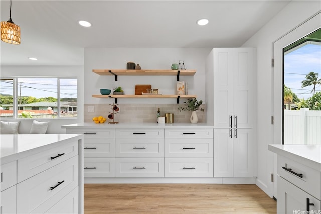 631 Punaa St, Kailua, HI 96734 - kitchen featuring light countertops, tasteful backsplash, recessed lighting, white cabinetry, and light wood finished floors