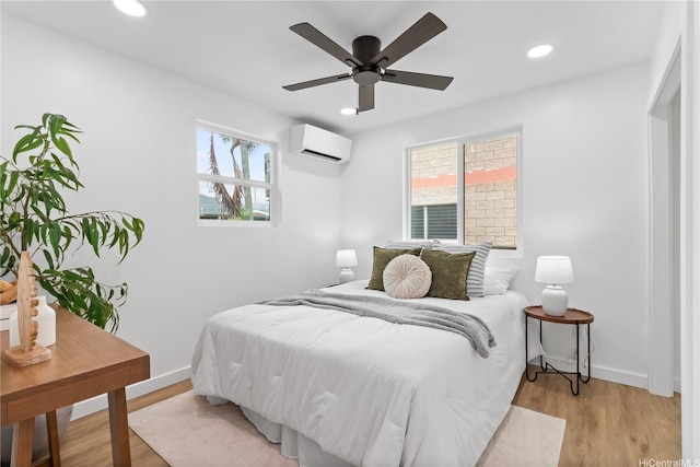 631 Punaa St, Kailua, HI 96734 - bedroom featuring an AC wall unit, light wood-type flooring, recessed lighting, and baseboards
