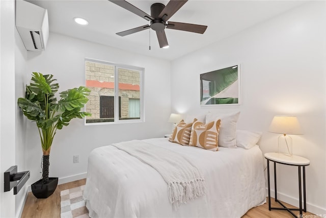 631 Punaa St, Kailua, HI 96734 - bedroom featuring a wall mounted AC, wood finished floors, baseboards, recessed lighting, and a ceiling fan