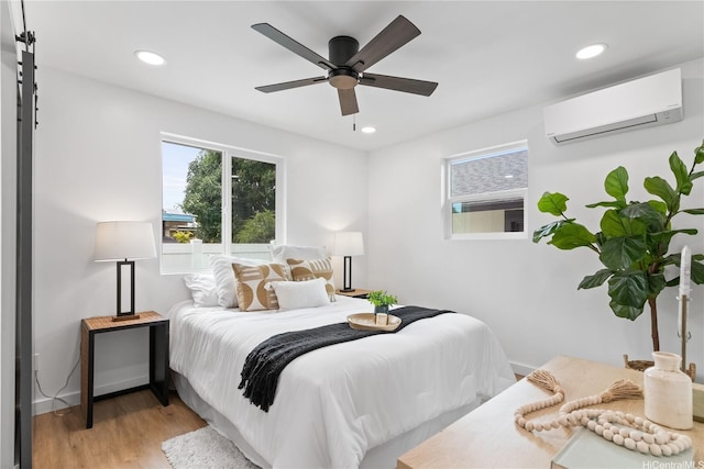 631 Punaa St, Kailua, HI 96734 - bedroom featuring an AC wall unit, light wood-style flooring, recessed lighting, a ceiling fan, and baseboards
