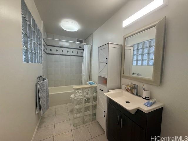1630 Liholiho St Unit 2001, Honolulu, HI 96822 - bathroom with tile patterned floors, vanity, shower / bath combo, and toilet