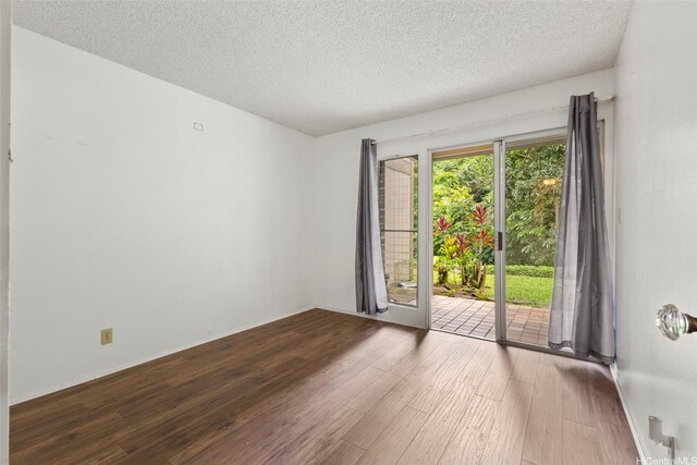 47-658 Hui Kelu St Unit 5, Kaneohe, HI 96744 - unfurnished room featuring wood finished floors and a textured ceiling