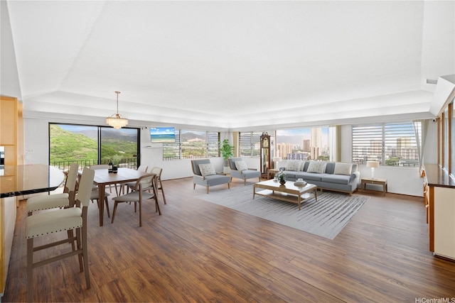 941 Aliamanu Pl, Honolulu, HI 96818 - living room featuring wood finished floors and a raised ceiling
