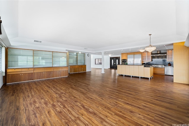941 Aliamanu Pl, Honolulu, HI 96818 - unfurnished living room featuring a tray ceiling, dark wood finished floors, a chandelier, and recessed lighting