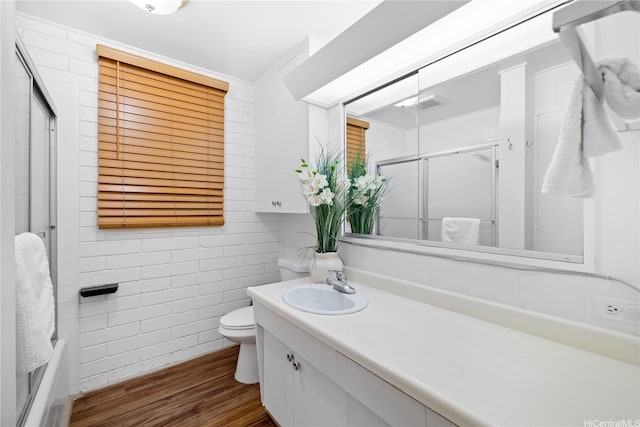 941 Aliamanu Pl, Honolulu, HI 96818 - full bathroom featuring a shower with door, wood finished floors, and vanity