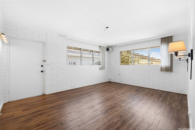941 Aliamanu Pl, Honolulu, HI 96818 - empty room with wood finished floors and brick wall