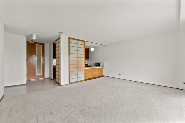 1519 Nuuanu Ave Unit 1044, Honolulu, HI 96817 - unfurnished living room featuring baseboards and carpet floors
