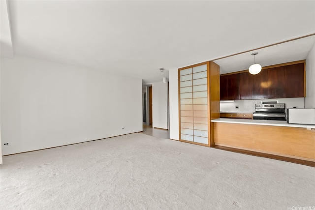1519 Nuuanu Ave Unit 1044, Honolulu, HI 96817 - kitchen featuring electric range, carpet flooring, and hanging light fixtures