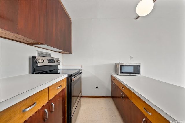 1519 Nuuanu Ave Unit 1044, Honolulu, HI 96817 - kitchen featuring appliances with stainless steel finishes, light flooring, light countertops, and baseboards