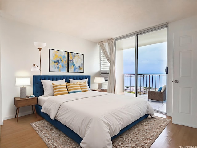 98-099 Uao Pl Unit 3209, Aiea, HI 96701 - bedroom featuring access to exterior, light wood finished floors, floor to ceiling windows, and baseboards