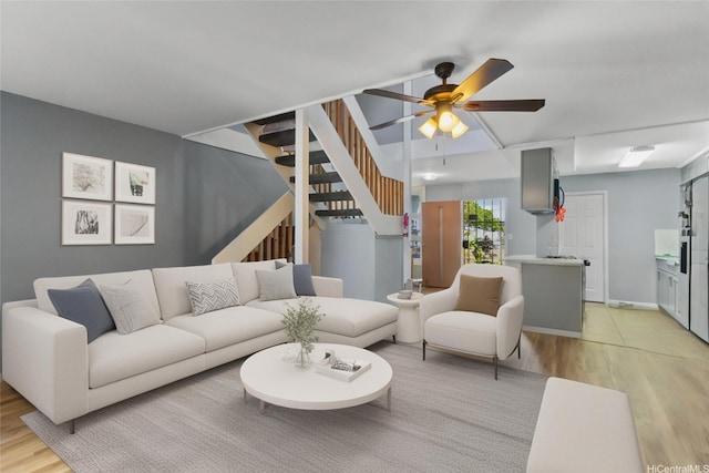 95-100 Moenamanu St Unit 458, Mililani, HI 96789 - living area with light wood finished floors, stairs, and a ceiling fan