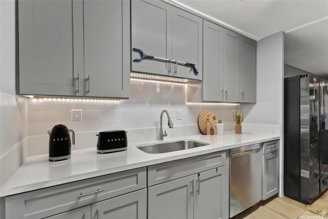 95-100 Moenamanu St Unit 458, Mililani, HI 96789 - kitchen with dishwasher, fridge with ice dispenser, gray cabinets, and a sink