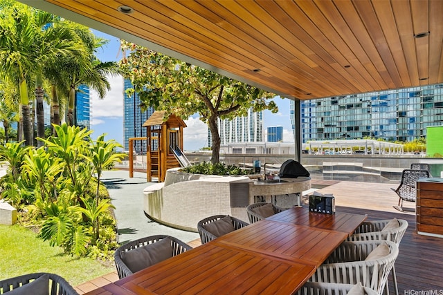 1108 Auahi St Unit 507, Honolulu, HI 96814 - view of patio / terrace with outdoor dining area and a wooden deck