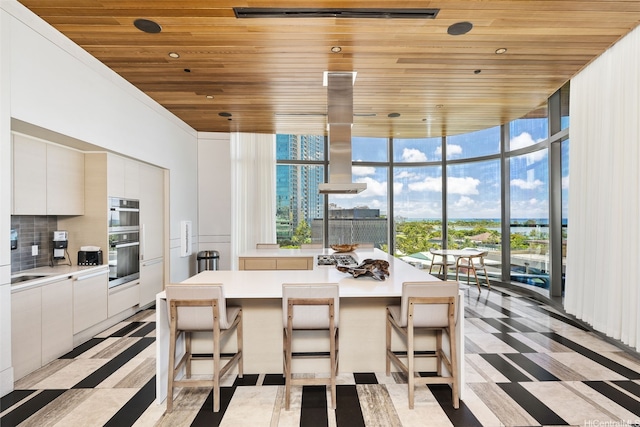 1108 Auahi St Unit 507, Honolulu, HI 96814 - dining area with wood ceiling, light floors, healthy amount of natural light, and expansive windows