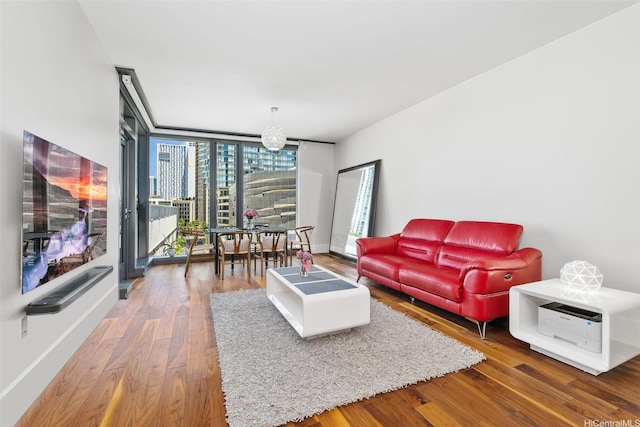 1108 Auahi St Unit 507, Honolulu, HI 96814 - living room with floor to ceiling windows, wood finished floors, and a chandelier