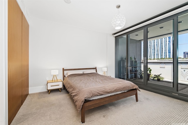 1108 Auahi St Unit 507, Honolulu, HI 96814 - carpeted bedroom with access to exterior, baseboards, and a wall of windows