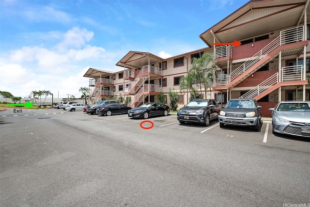 98-626 Moanalua Loop Unit 304, Aiea, HI 96701 - view of apartment building / complex featuring uncovered parking