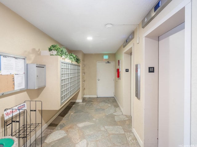 710 Lunalilo St Unit 402, Honolulu, HI 96813 - hall with stone finish floors, elevator, and mail area