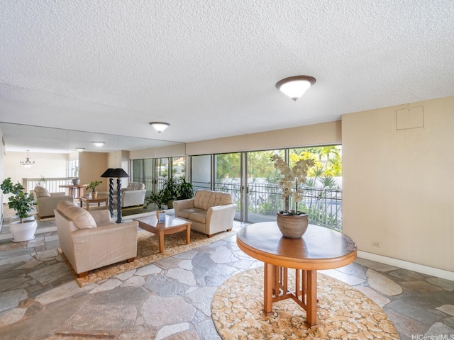 710 Lunalilo St Unit 402, Honolulu, HI 96813 - living room featuring stone finish flooring and a textured ceiling