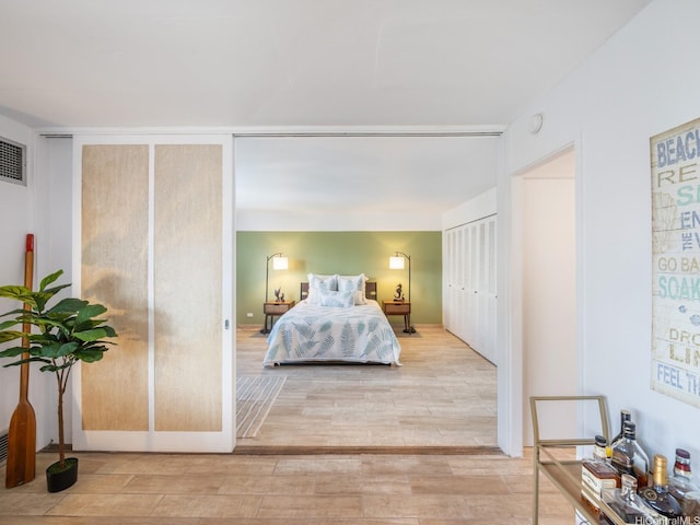 710 Lunalilo St Unit 402, Honolulu, HI 96813 - bedroom featuring light wood-style flooring