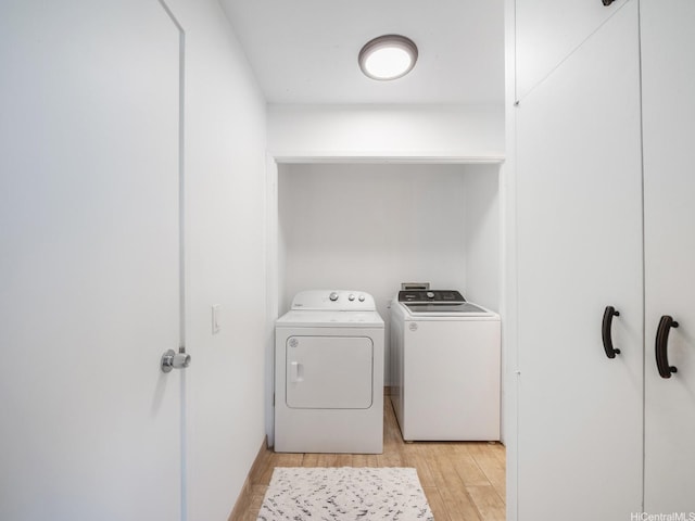 710 Lunalilo St Unit 402, Honolulu, HI 96813 - laundry room with washing machine and dryer and light wood finished floors