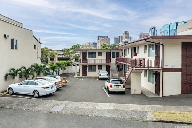 1408 Lusitana St, Honolulu, HI 96813 - view of property featuring uncovered parking, a city view, and stairs