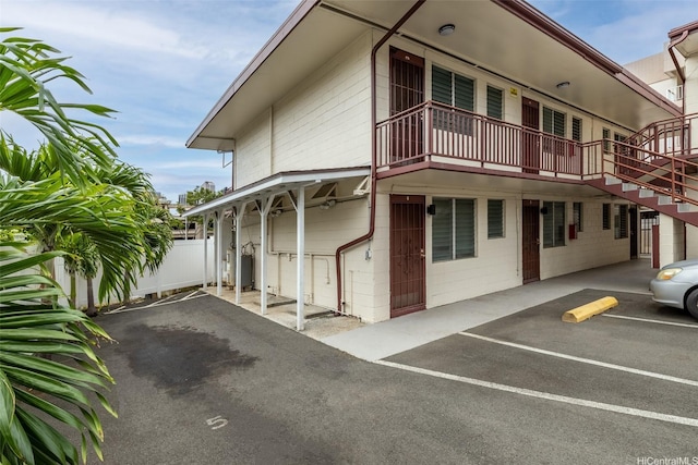 1408 Lusitana St, Honolulu, HI 96813 - view of building exterior with uncovered parking and stairway