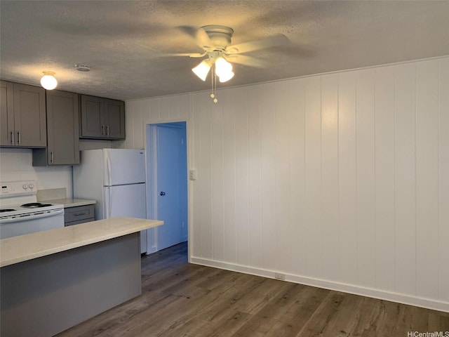 1408 Lusitana St, Honolulu, HI 96813 - kitchen featuring white appliances, a ceiling fan, light countertops, dark wood finished floors, and a textured ceiling
