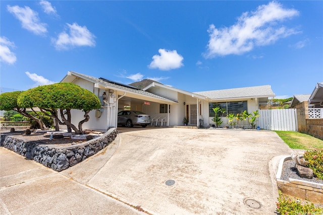 463 Kaleimamahu St, Honolulu, HI 96825 - single story home featuring concrete driveway, roof mounted solar panels, and a carport