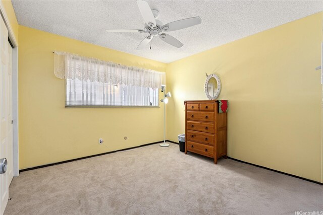 463 Kaleimamahu St, Honolulu, HI 96825 - bedroom with carpet flooring, a textured ceiling, a closet, and a ceiling fan