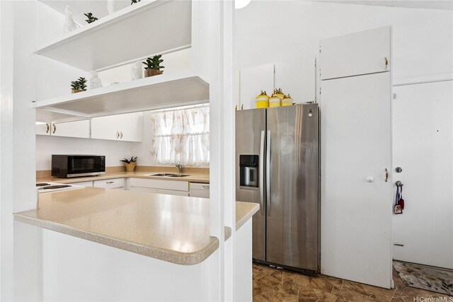 463 Kaleimamahu St, Honolulu, HI 96825 - kitchen featuring stainless steel refrigerator with ice dispenser, white cabinets, open shelves, light countertops, and a peninsula