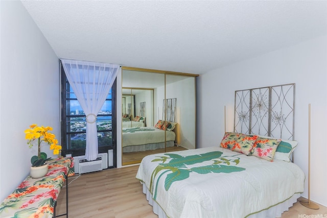 98-500 Koauka Loop Unit 23H, Aiea, HI 96701 - bedroom with wood finished floors and a closet