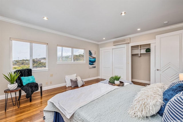 1011-L Alewa Dr, Honolulu, HI 96817 - bedroom featuring wood finished floors, a wall mounted air conditioner, ornamental molding, and recessed lighting