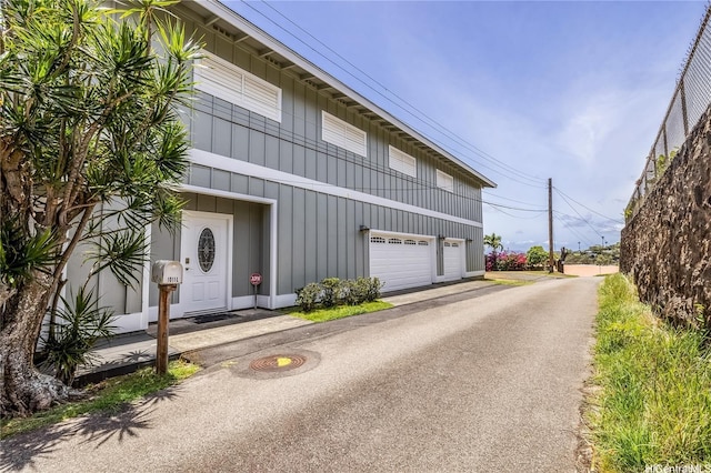 1011-L Alewa Dr, Honolulu, HI 96817 - view of front of house featuring an attached garage and driveway