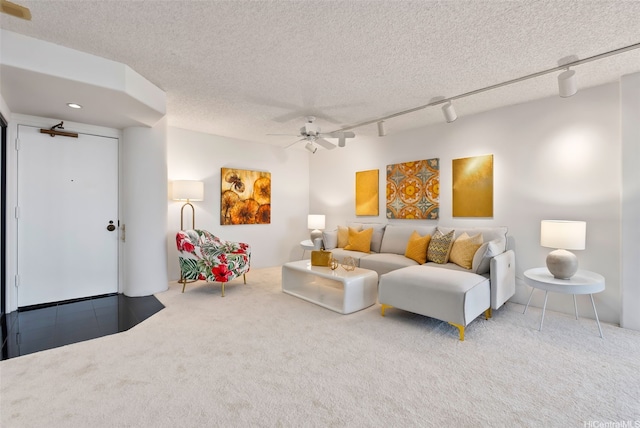 1212 Nuuanu Ave Unit 2509, Honolulu, HI 96817 - living area with carpet floors, ceiling fan, track lighting, and a textured ceiling