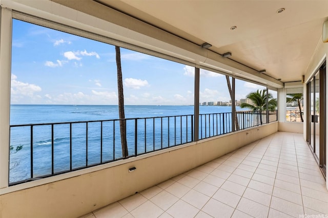2893 Kalakaua Ave Unit 3, Honolulu, HI 96815 - unfurnished sunroom with a water view and tile patterned floors