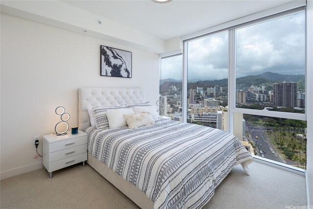 888 Kapiolani Blvd Unit 2703, Honolulu, HI 96813 - bedroom with light colored carpet, a view of city, a mountain view, and expansive windows