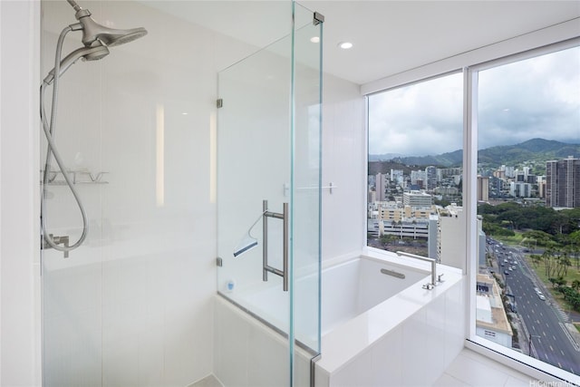 888 Kapiolani Blvd Unit 2703, Honolulu, HI 96813 - full bath with a tile shower, a bath, a mountain view, and a city view