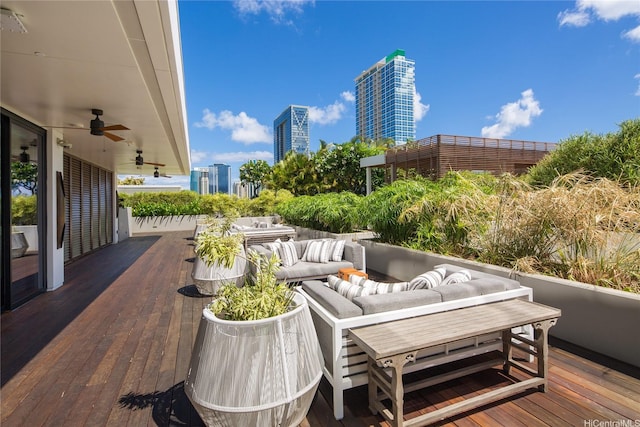 888 Kapiolani Blvd Unit 2703, Honolulu, HI 96813 - wooden terrace featuring an outdoor hangout area, ceiling fan, and a view of city