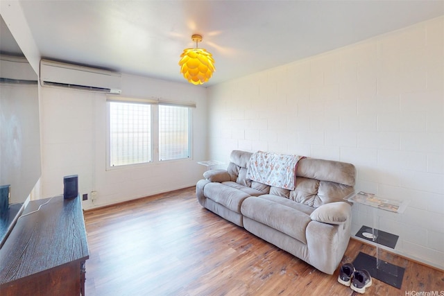 91-652 Kilaha St Unit A4, Ewa Beach, HI 96706 - living room featuring a wall mounted AC and wood finished floors