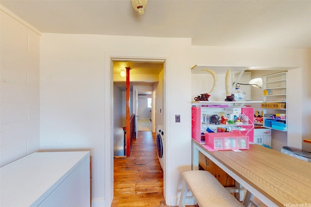 91-652 Kilaha St Unit A4, Ewa Beach, HI 96706 - hall featuring wood finished floors and washer / dryer
