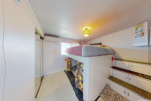 91-652 Kilaha St Unit A4, Ewa Beach, HI 96706 - bedroom featuring a wall mounted AC and light colored carpet